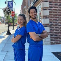 Photo of Dr. Changi with assistant Alyvia, in blue scrubs in downtown Buckhannon WV