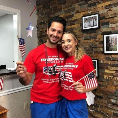Photo of Dr. Changi and Alyvia in Freedom Day USA shirts